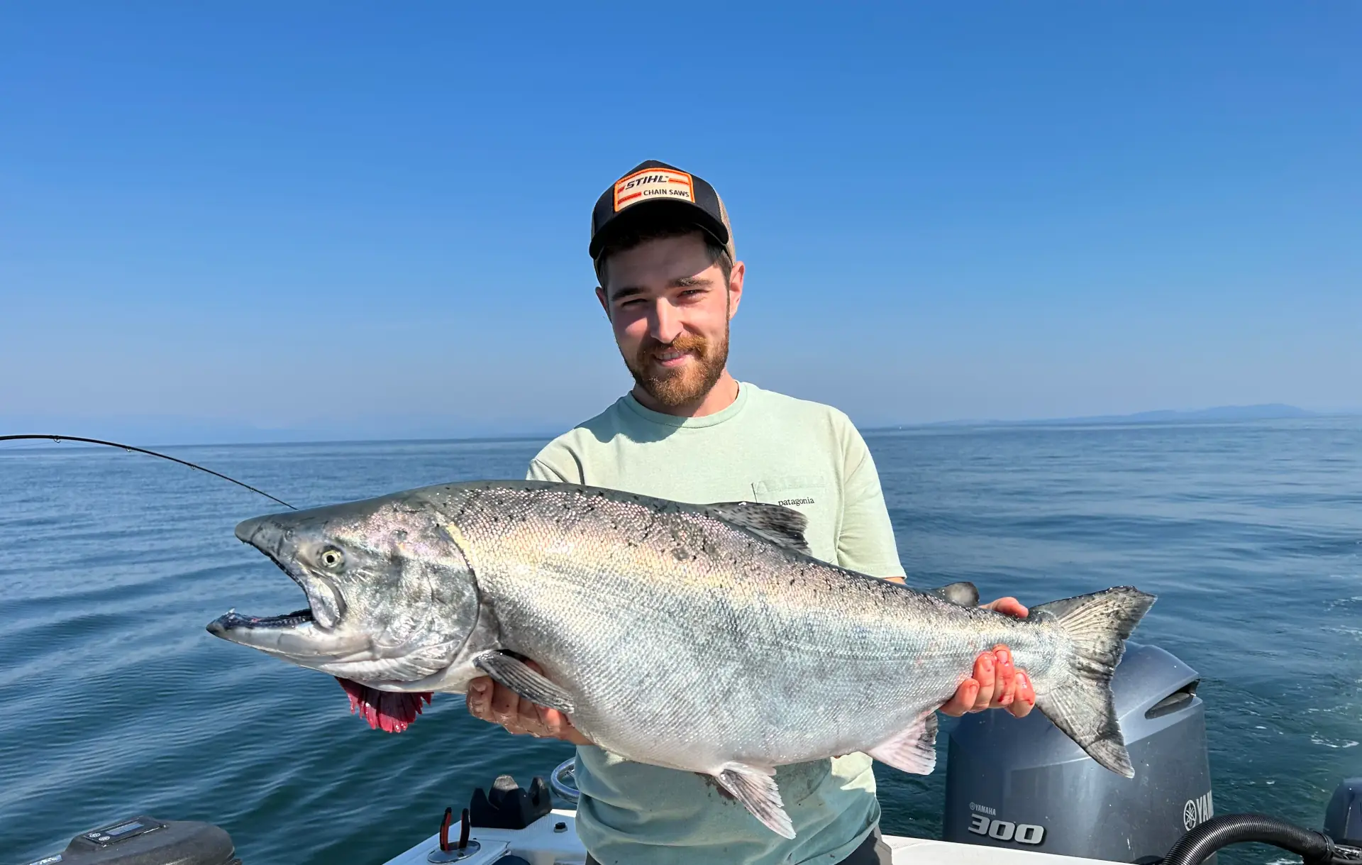 man holding large fish caught off Comox