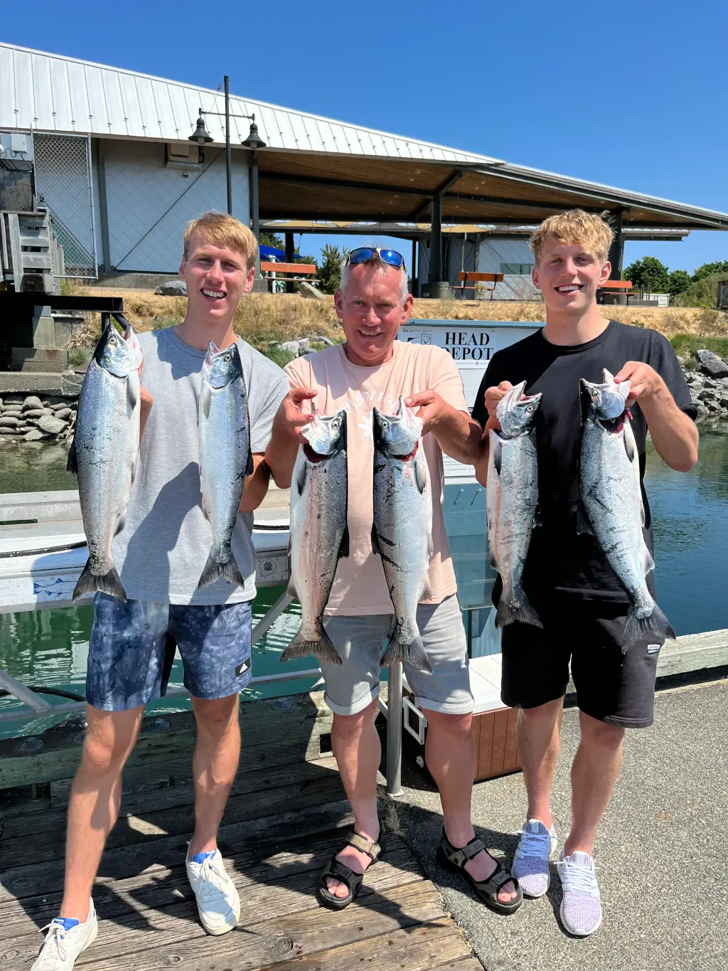 family showing off the salmon caught off Campbell River