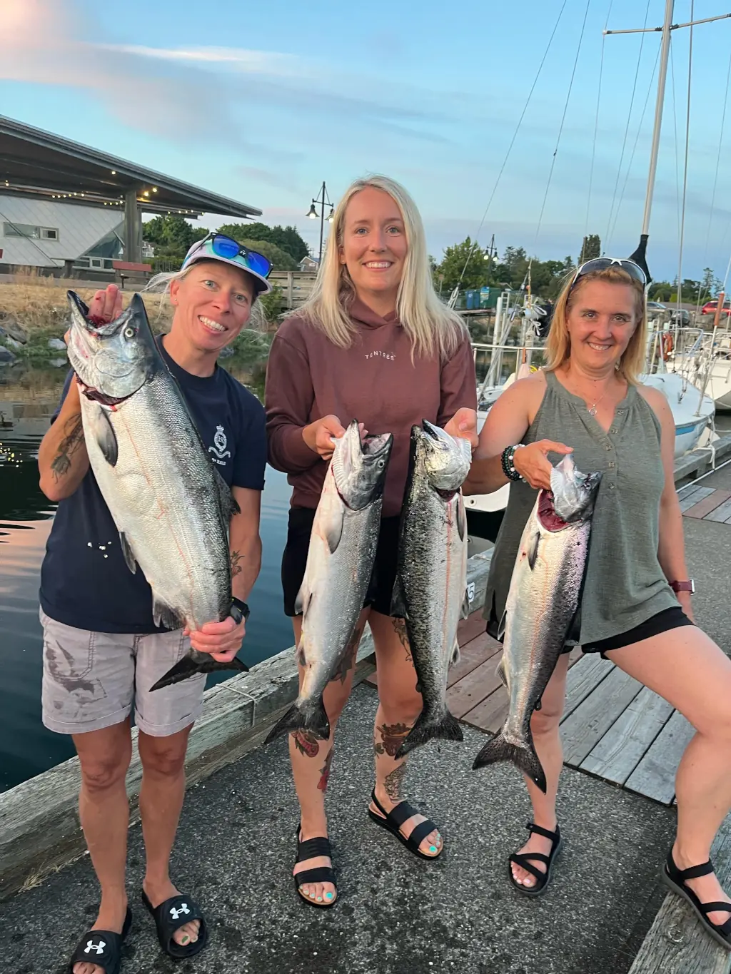 3 women showing off their catch in Comox