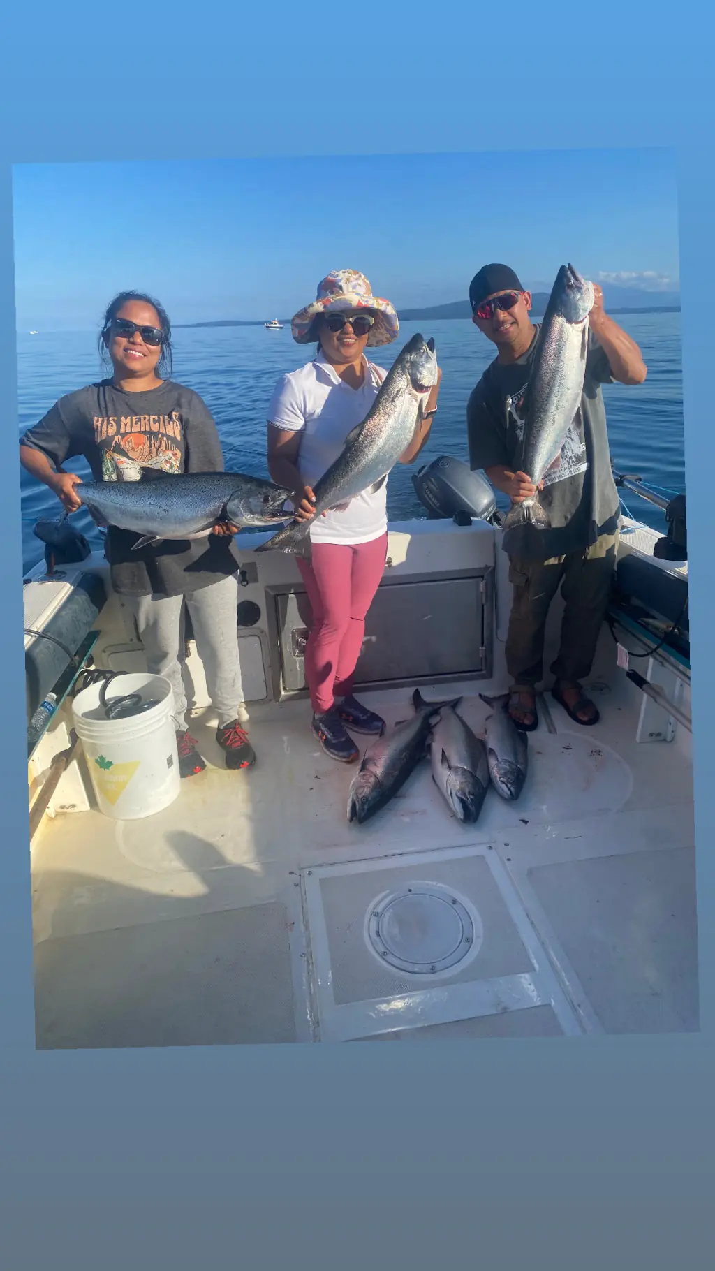 fishing charter group displaying their salmon