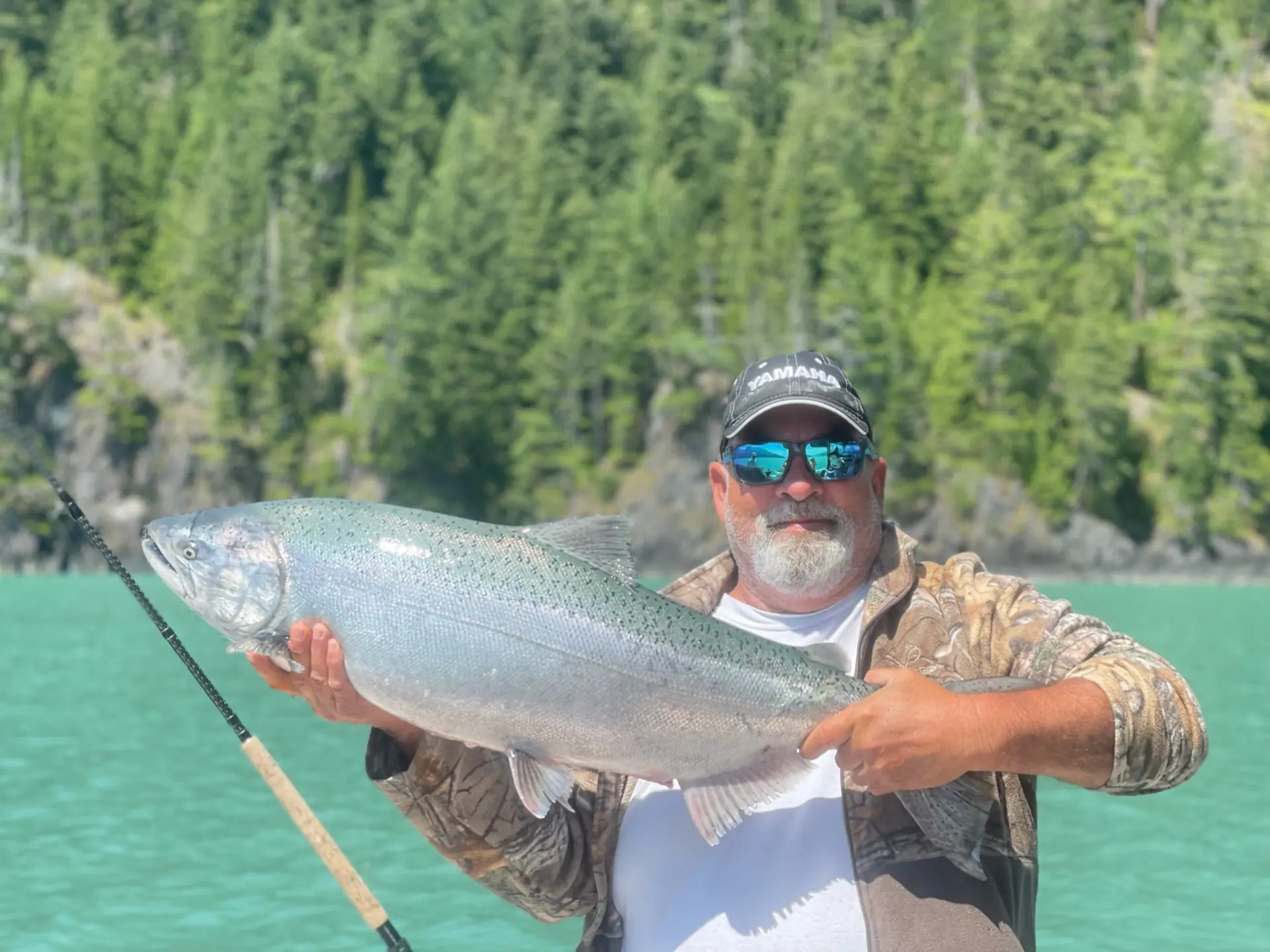 man holdinga salmon caught with Cliff's Chinook Charters