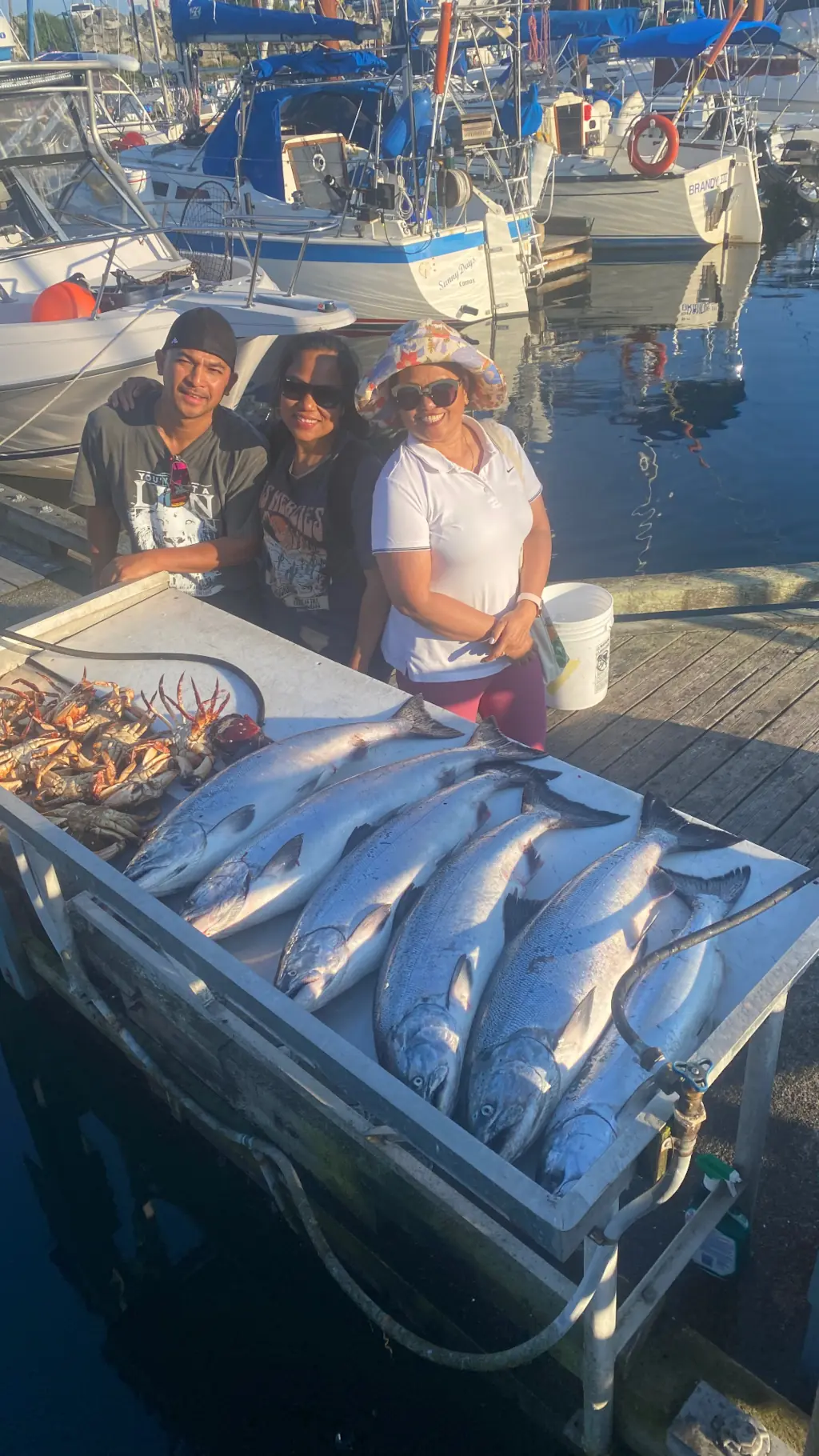 group showing off all the salmon they caught with Cliff's Fishing Charters