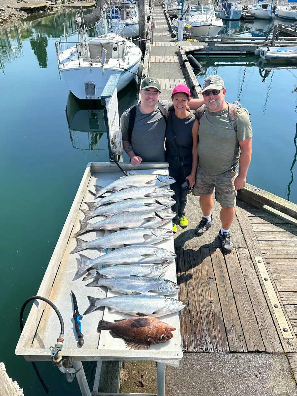 group showing off the salmon they caught near Comox