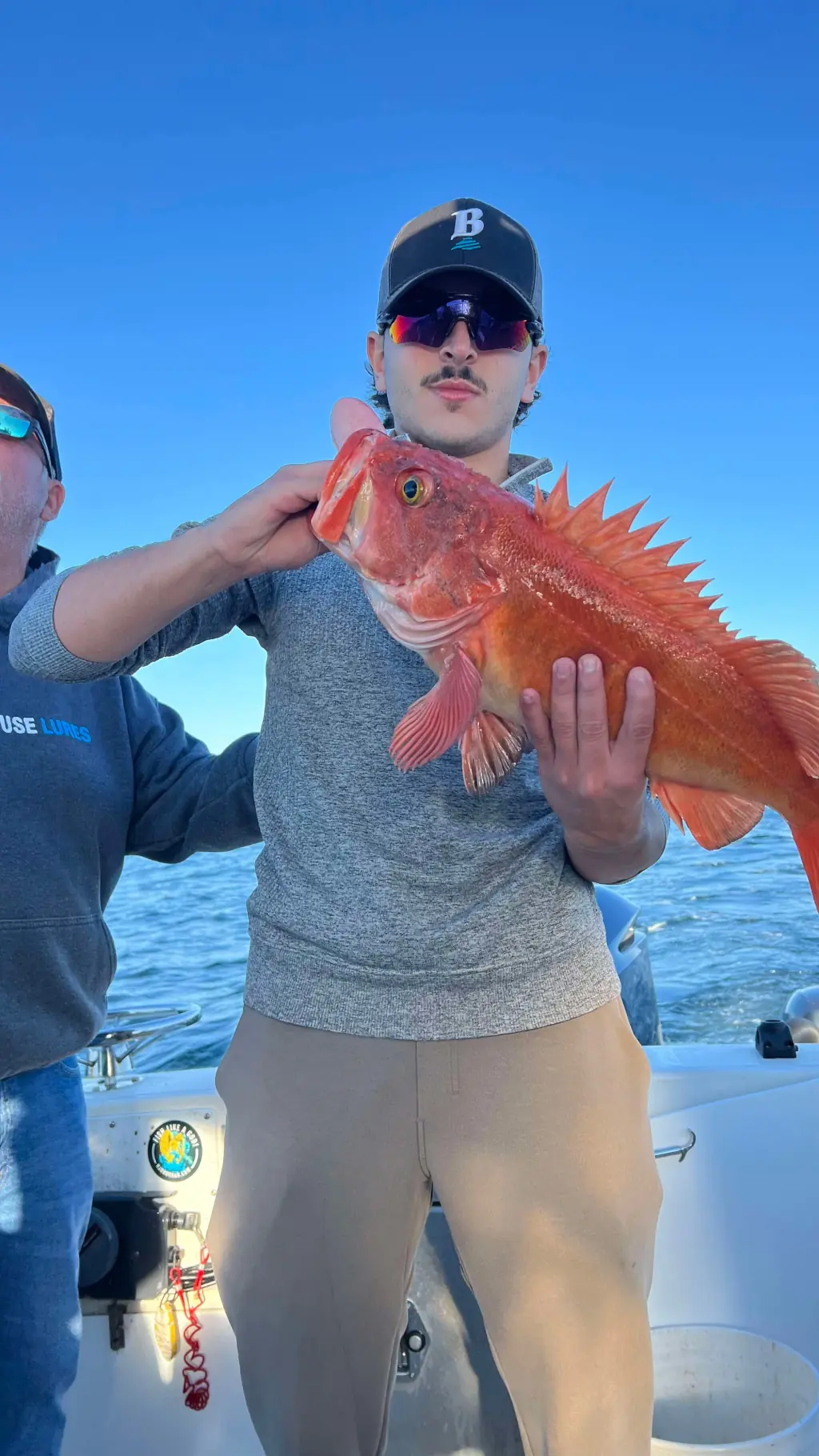 guest showing off a cod caught off Comox