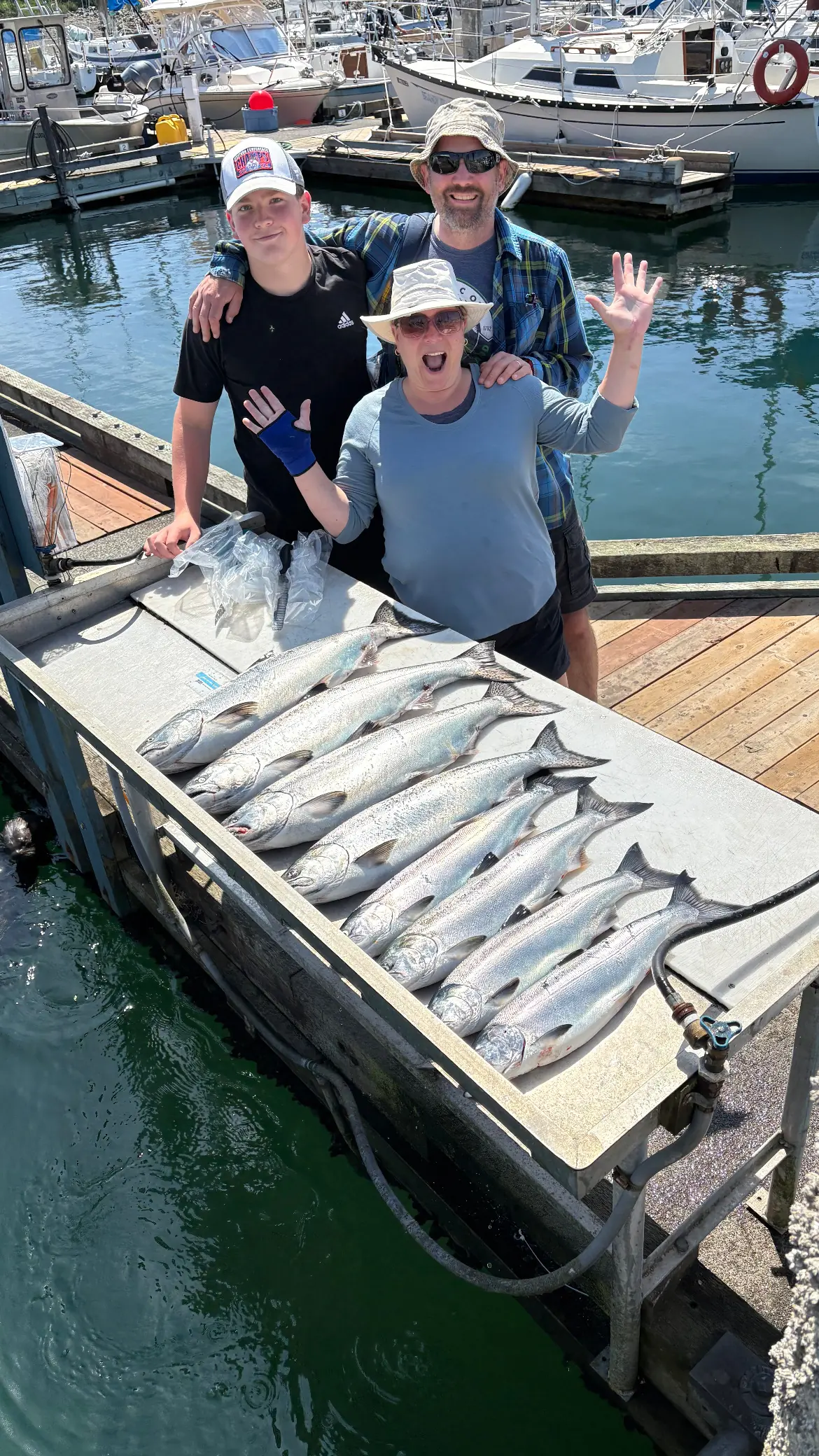 family excited about the fish caught in the waters near Courtenay