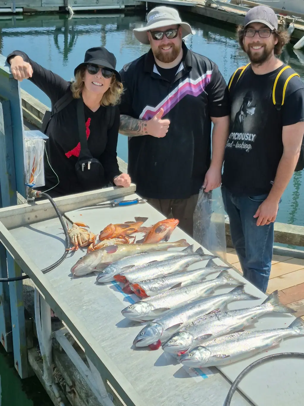 family showing their catch with Cliff's Fishing Charters