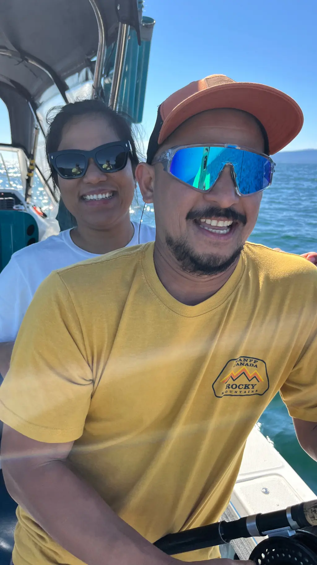 happy couple on a fishing charter in Comox